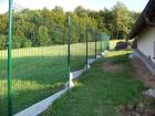 Panelový drátěný plot VEGA B Light, sloupek Omega kulatý 48 mm, barva zelená RAL 6005